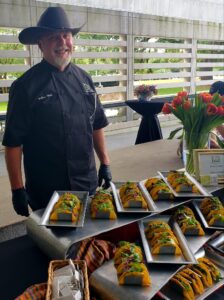 Chef Wells and catering display of smoked shrimp tacos