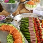Wedding catering display assorted dips asparagus smoked salmon